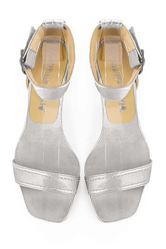 Light silver women's closed back sandals, with a strap around the ankle. Square toe. Medium comma heels. Top view - Florence KOOIJMAN